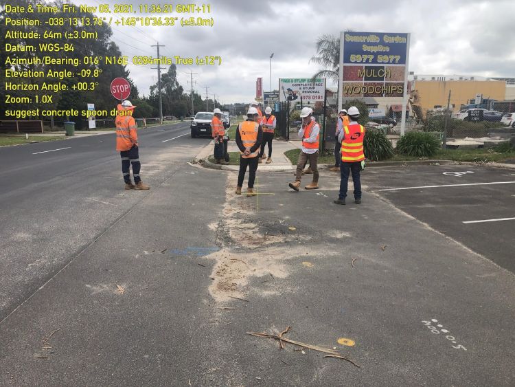 Geotechnical engineers surveying road